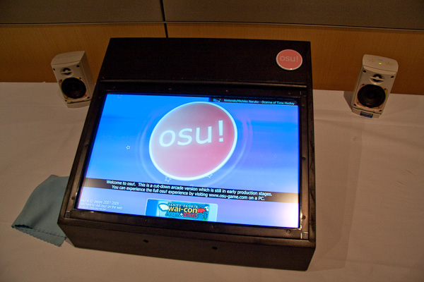 A touchscreen displaying osu!'s main menu